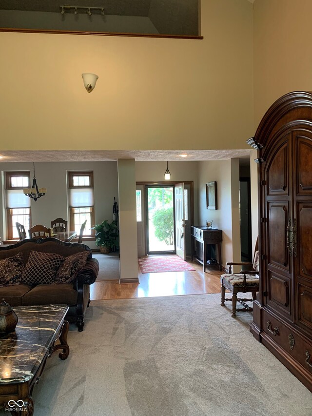 466 Sycamore Ridge Ct, Avon, IN 46123 - carpeted entryway featuring a high ceiling and wood finished floors