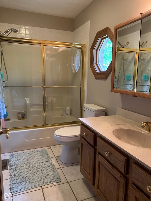 466 Sycamore Ridge Ct, Avon, IN 46123 - bathroom featuring toilet, vanity, bath / shower combo with glass door, and tile patterned flooring