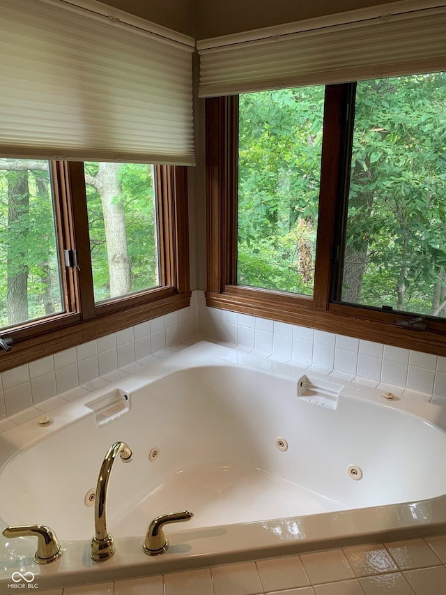 bathroom featuring a relaxing tiled tub