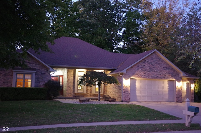 466 Sycamore Ridge Ct, Avon, IN 46123 - view of front of home featuring an attached garage, driveway, a front lawn, and brick siding