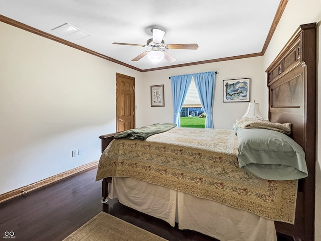 bedroom featuring ceiling fan, dark hardwood / wood-style floors, and ornamental molding