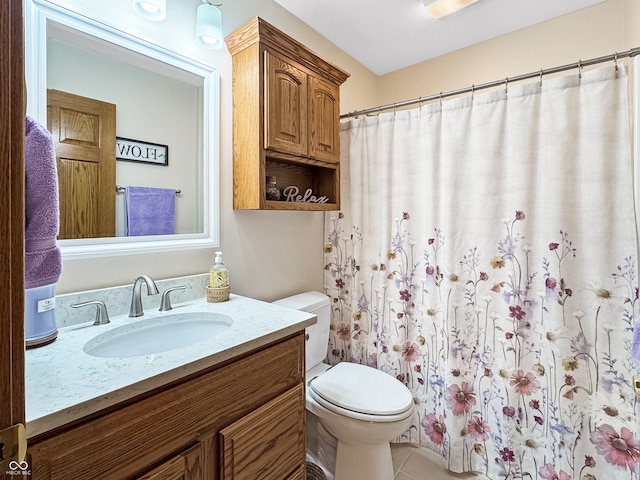 bathroom with toilet, vanity, a shower with shower curtain, and tile patterned flooring