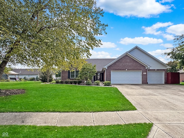 view of front of house featuring a garage and a front yard