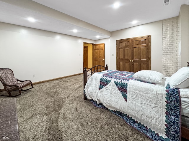 carpeted bedroom featuring a closet