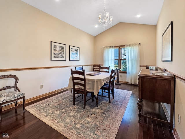 dining area featuring vaulted ceiling, a notable chandelier, and dark hardwood / wood-style flooring