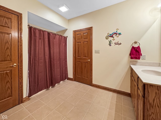 bathroom featuring tile patterned flooring and vanity