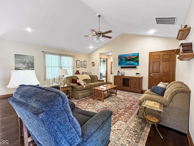 living room featuring ceiling fan, vaulted ceiling, and dark wood-type flooring