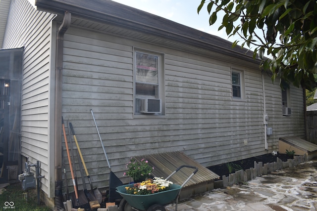 view of side of home with cooling unit