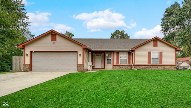 ranch-style home featuring a garage and a front lawn