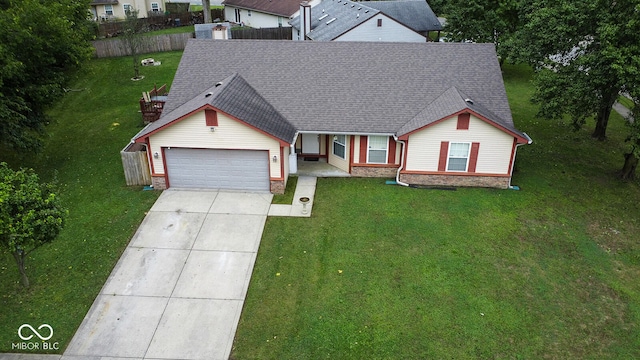 ranch-style home with a garage and a front lawn