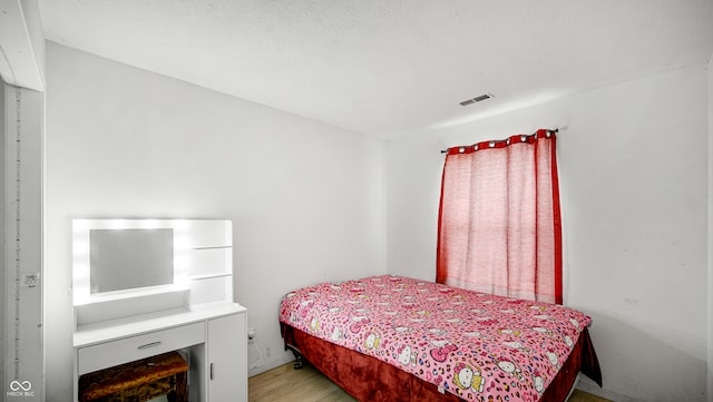 bedroom featuring light hardwood / wood-style flooring