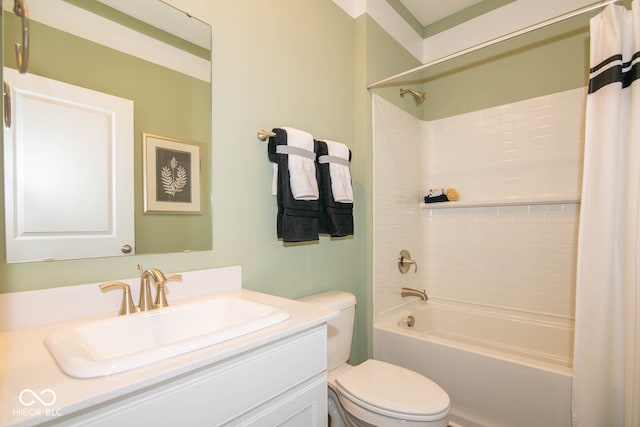 full bathroom with vanity, shower / tub combo, and toilet