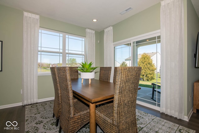 dining area featuring dark hardwood / wood-style flooring