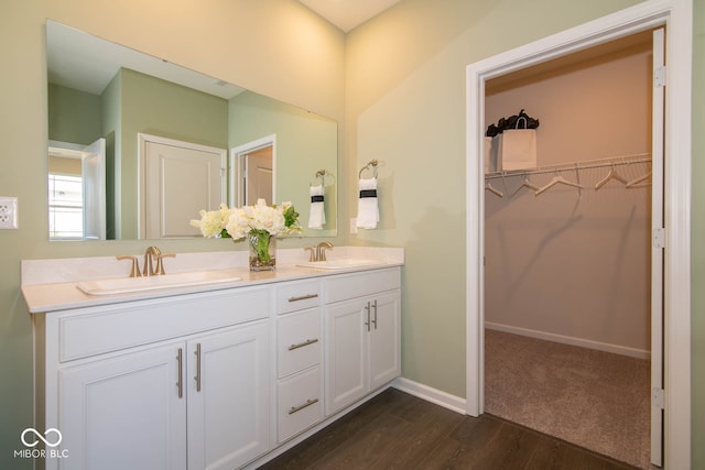 bathroom featuring vanity and hardwood / wood-style flooring