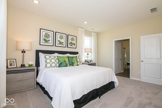 bedroom featuring light colored carpet