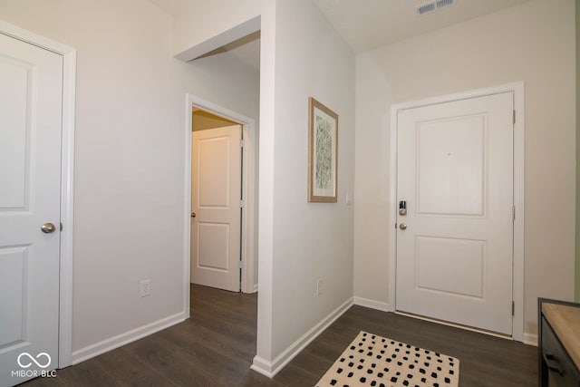 foyer entrance featuring dark hardwood / wood-style flooring