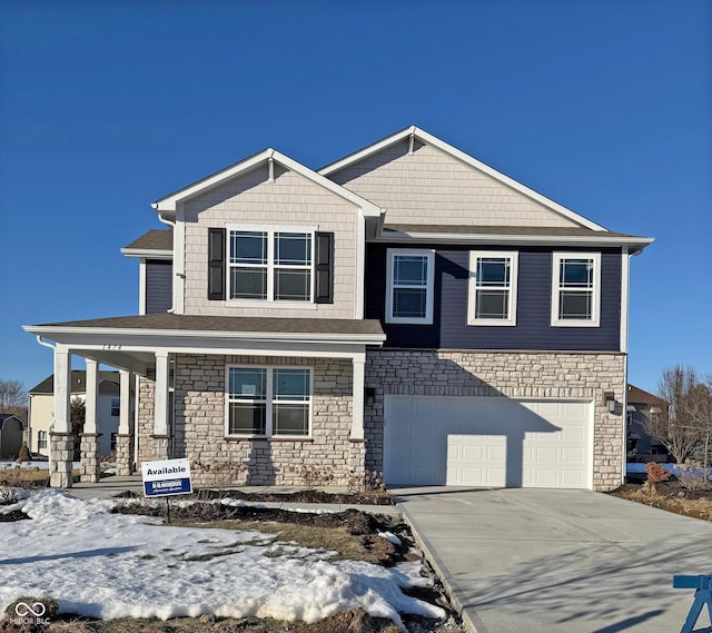 view of front of home featuring a garage and covered porch