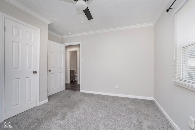 unfurnished bedroom featuring a textured ceiling, carpet, and ceiling fan