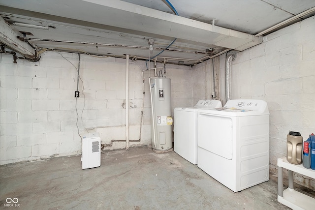 basement featuring water heater and washer and dryer