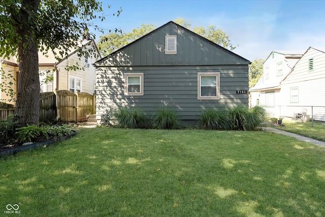 rear view of house with a lawn