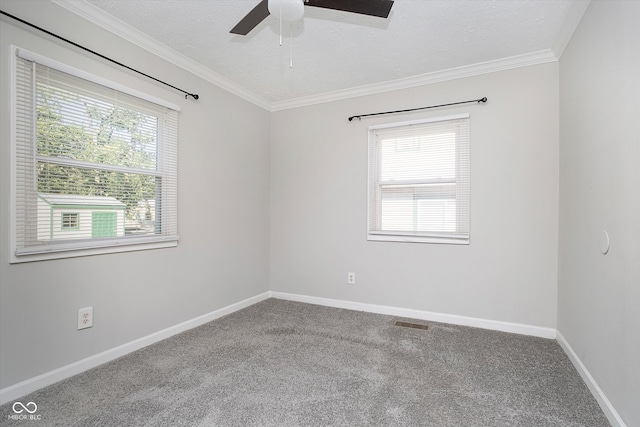 empty room featuring ceiling fan, crown molding, carpet flooring, and a textured ceiling