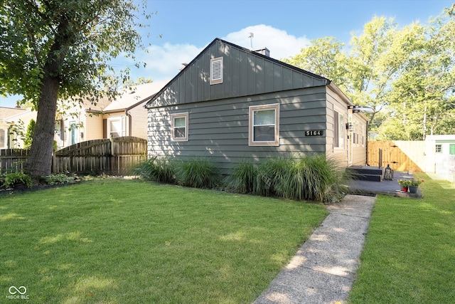 view of home's exterior with a yard