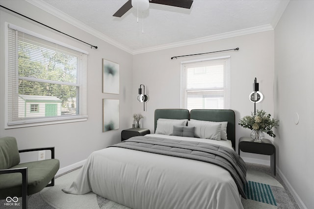 bedroom with ornamental molding, carpet, a textured ceiling, and ceiling fan