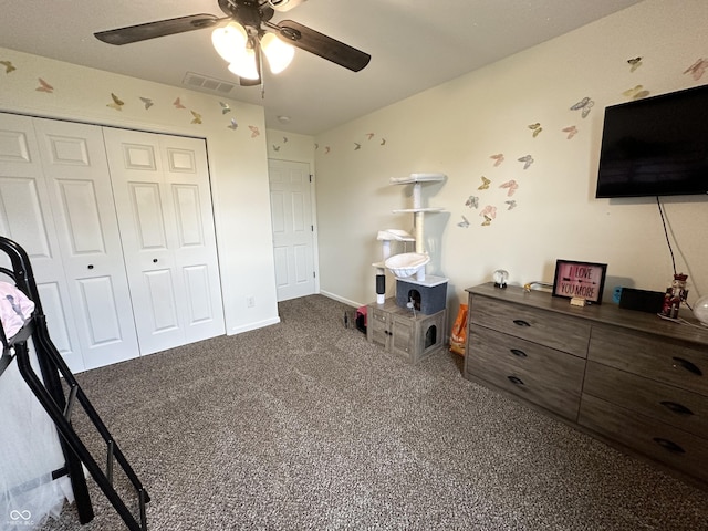 carpeted bedroom featuring baseboards, ceiling fan, a closet, and visible vents