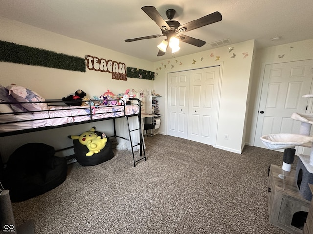 carpeted bedroom featuring visible vents, a ceiling fan, baseboards, and a closet