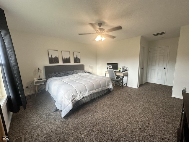 bedroom featuring dark colored carpet, a ceiling fan, baseboards, and visible vents