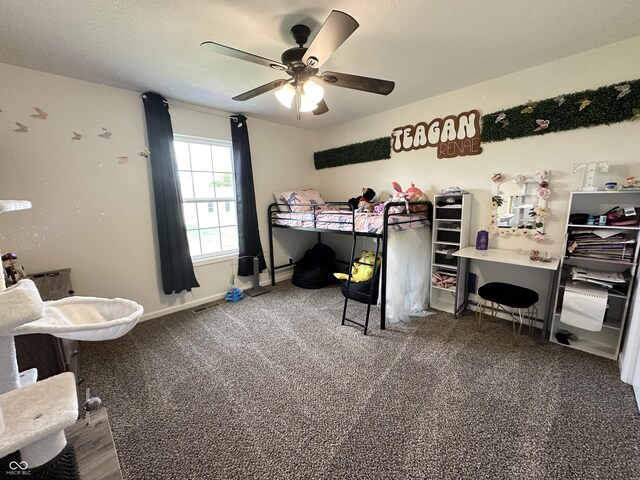 carpeted bedroom featuring baseboards, visible vents, and ceiling fan