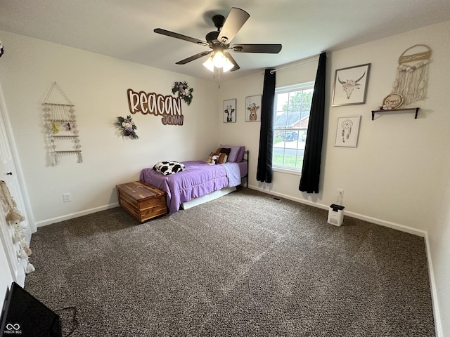 carpeted bedroom with baseboards and a ceiling fan