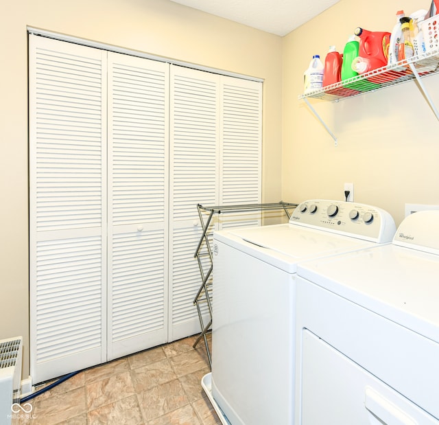 clothes washing area featuring independent washer and dryer