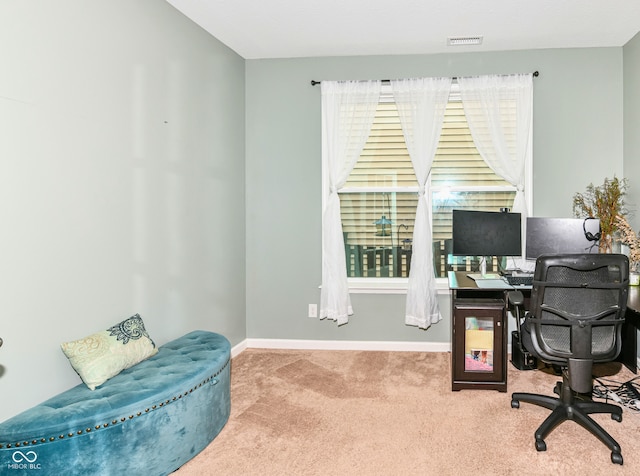 office with light carpet and a healthy amount of sunlight