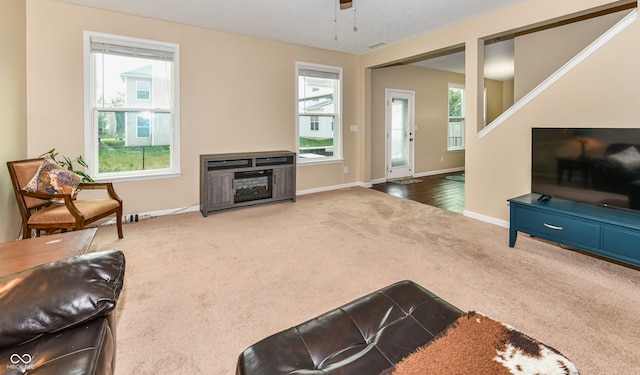 carpeted living room featuring a wealth of natural light