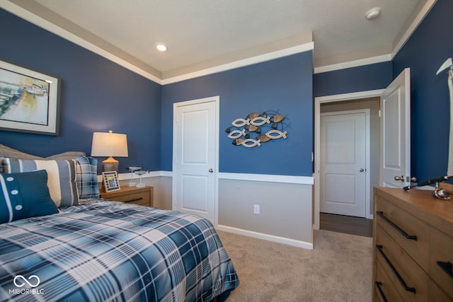 carpeted bedroom featuring crown molding