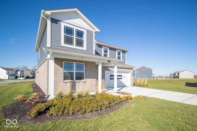 view of front of house featuring a front yard and a garage