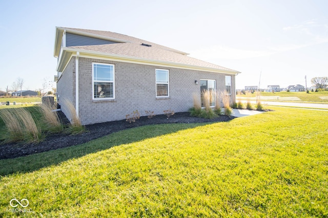 view of property exterior featuring a yard