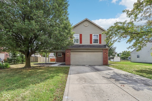 view of front of property featuring a front yard and a garage