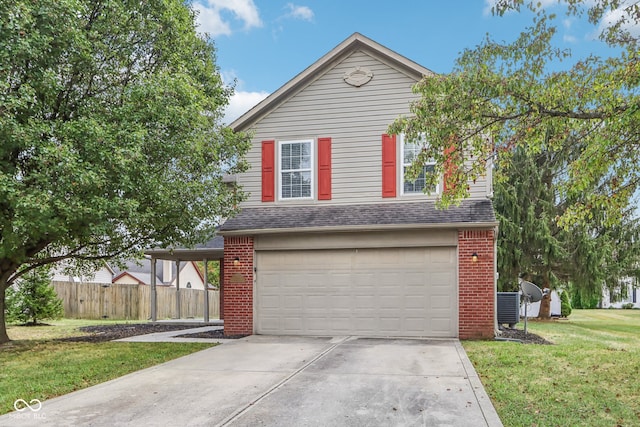 view of front property featuring a garage and a front yard