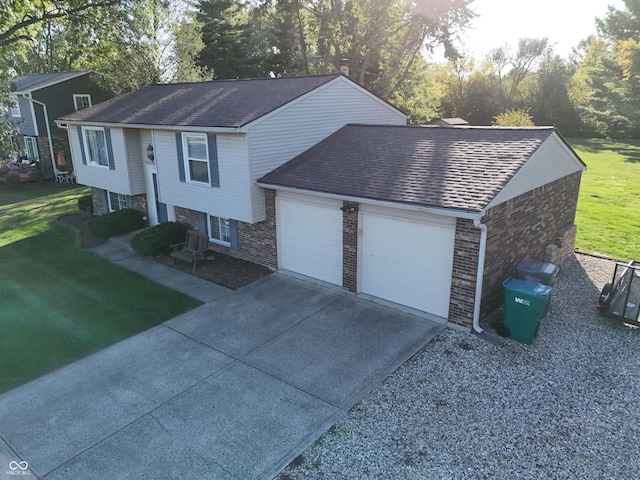 bi-level home featuring a front lawn and a garage