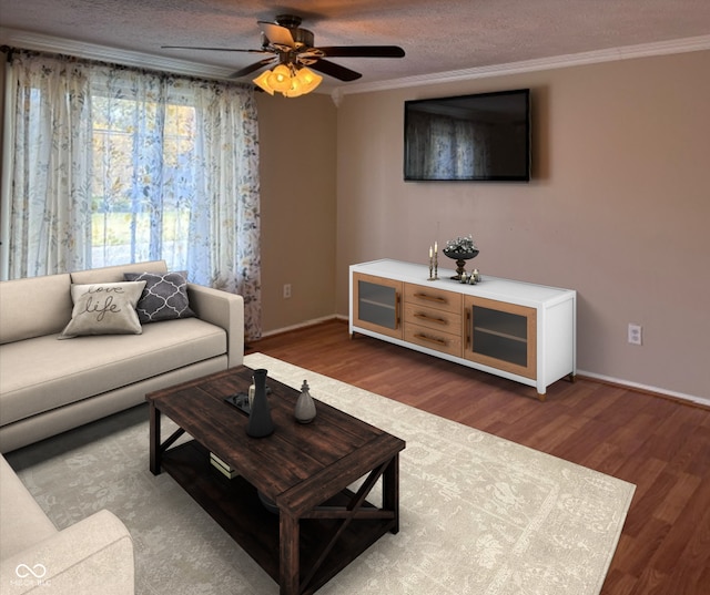 living room with ornamental molding, a textured ceiling, wood-type flooring, and ceiling fan