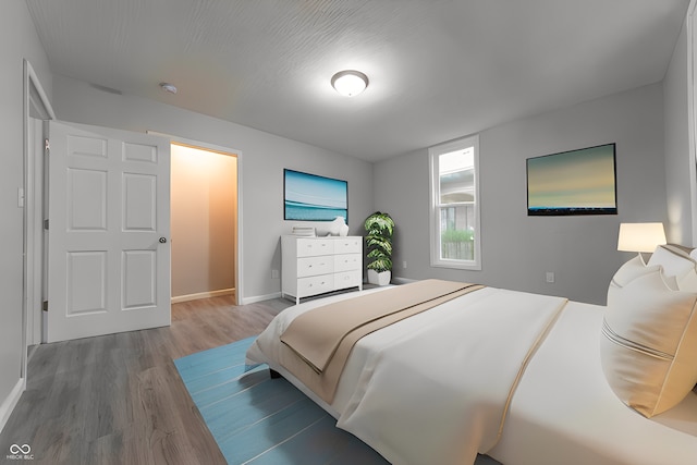 bedroom with wood-type flooring