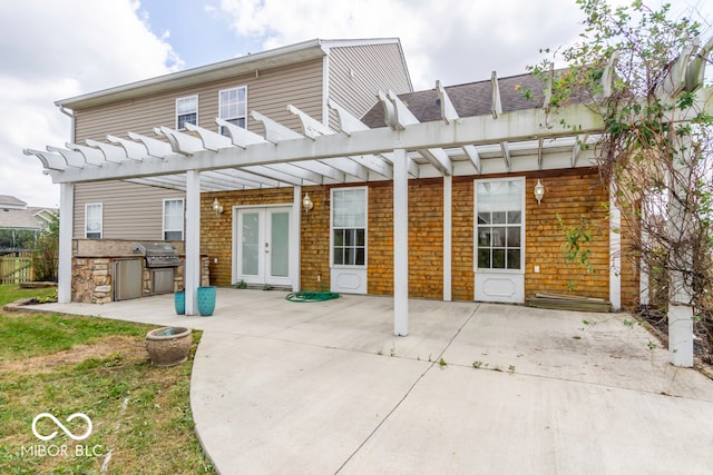 back of house with a pergola, area for grilling, a patio, and french doors