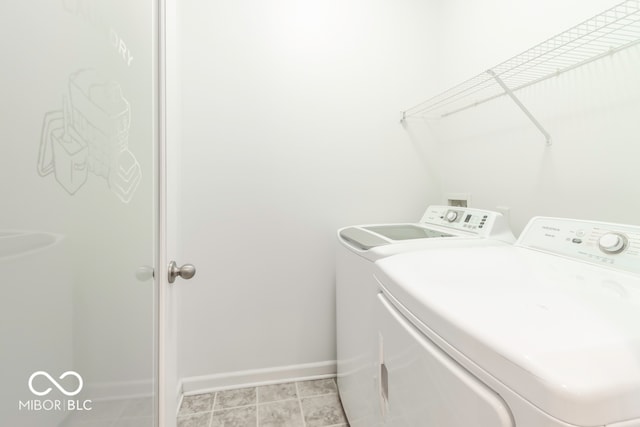 laundry area with washing machine and dryer