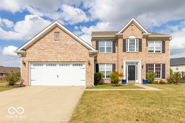 view of front of house featuring a garage and a front lawn