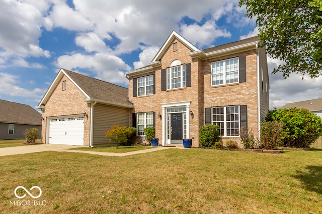 view of front of home with a garage and a front lawn