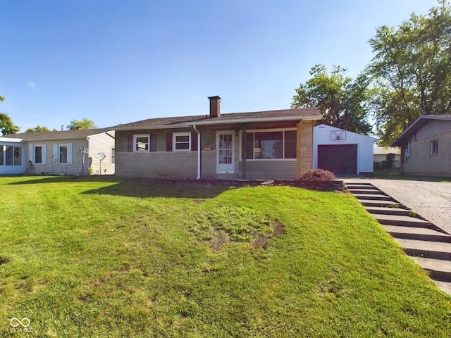 single story home with a garage and a front lawn