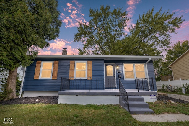 view of front of home featuring a yard