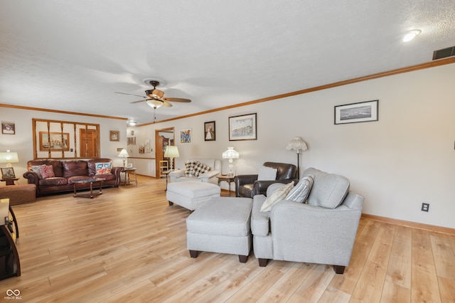 living room with a textured ceiling, crown molding, ceiling fan, and light hardwood / wood-style flooring